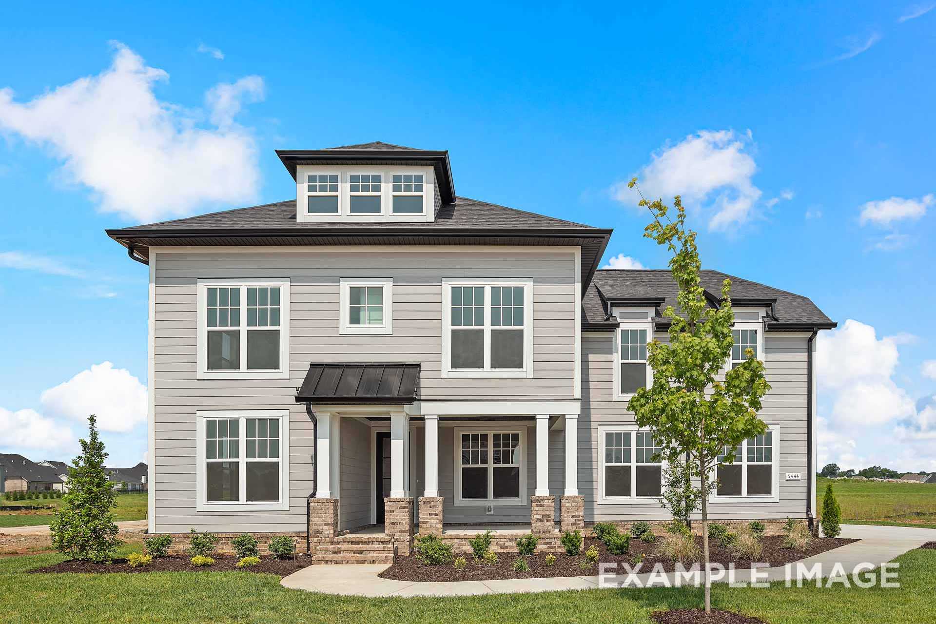 Two-story The Hathaway elevation featuring gray siding, black roof, stone porch accents, and landscaped yard in Murfreesboro