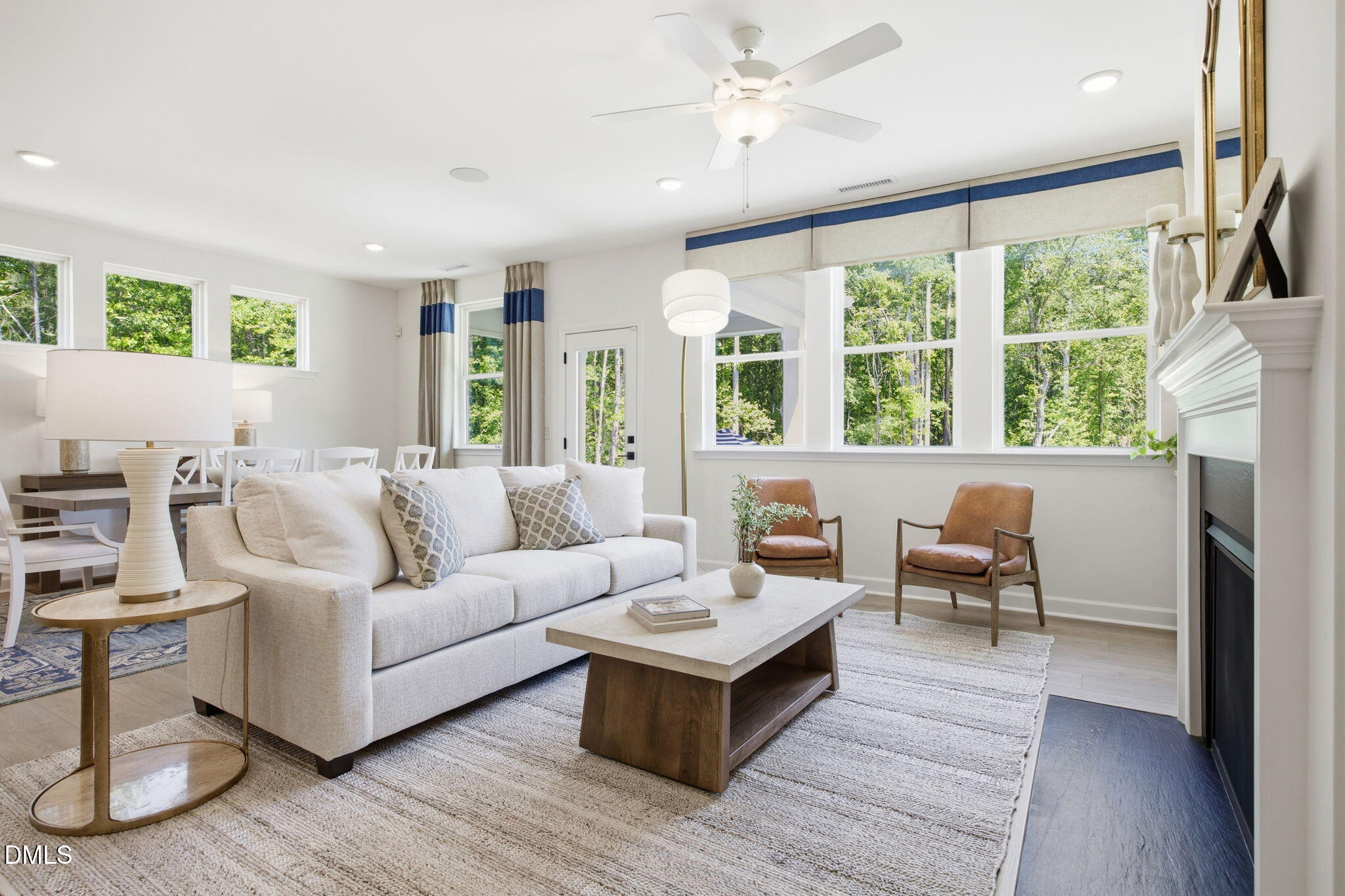 Bright open-concept living room with fireplace in The Ashport M floor plan at Wendell Ridge, Wendell, North Carolina.