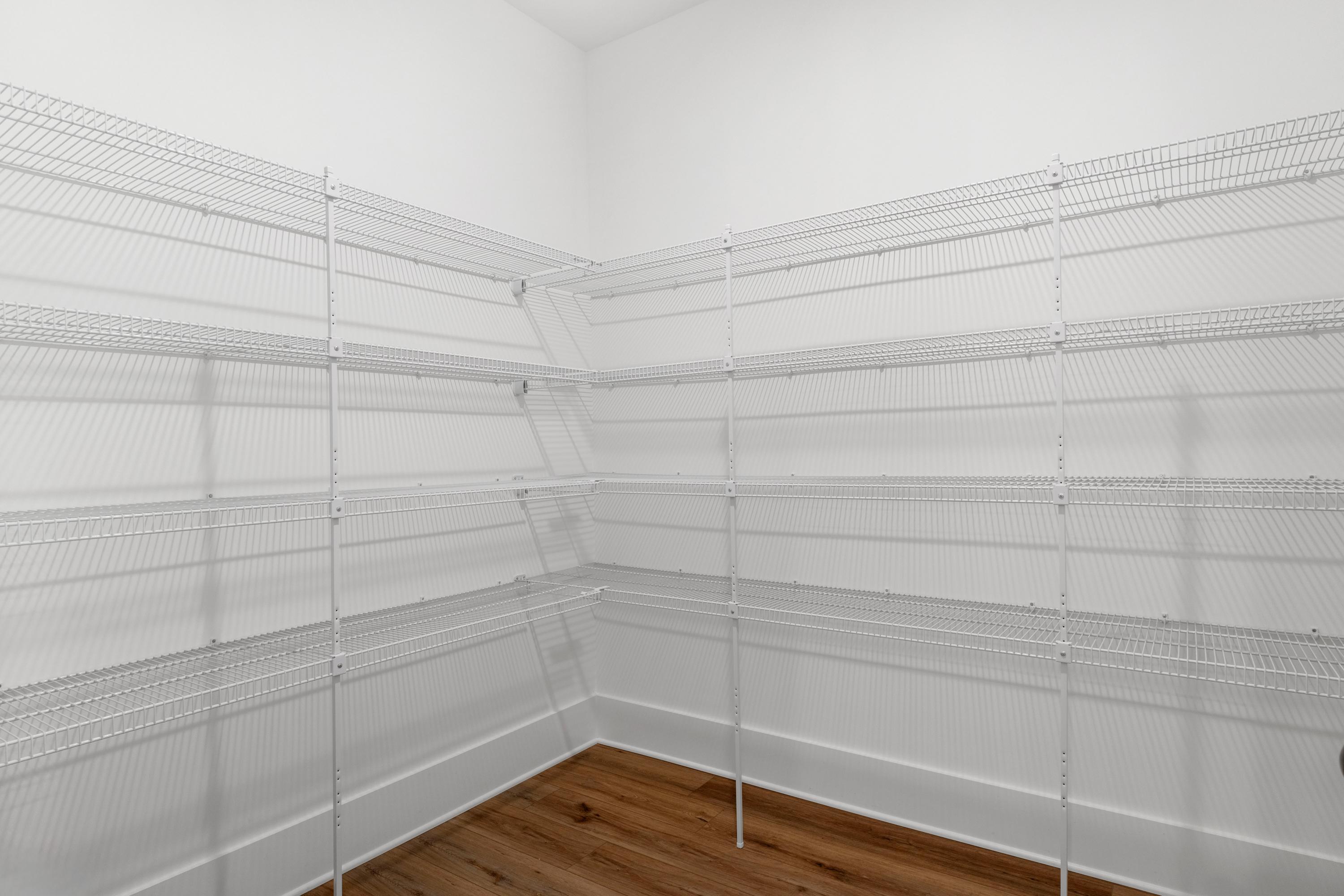 Spacious corner pantry with white wire shelving in Briercreek home, Meridianville Alabama by Davidson Homes