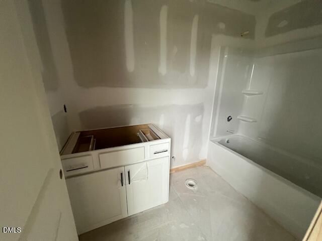 Bathroom under construction with white vanity and tub-shower combo in The Hickory II C at Retreat at North Main, Lillington.