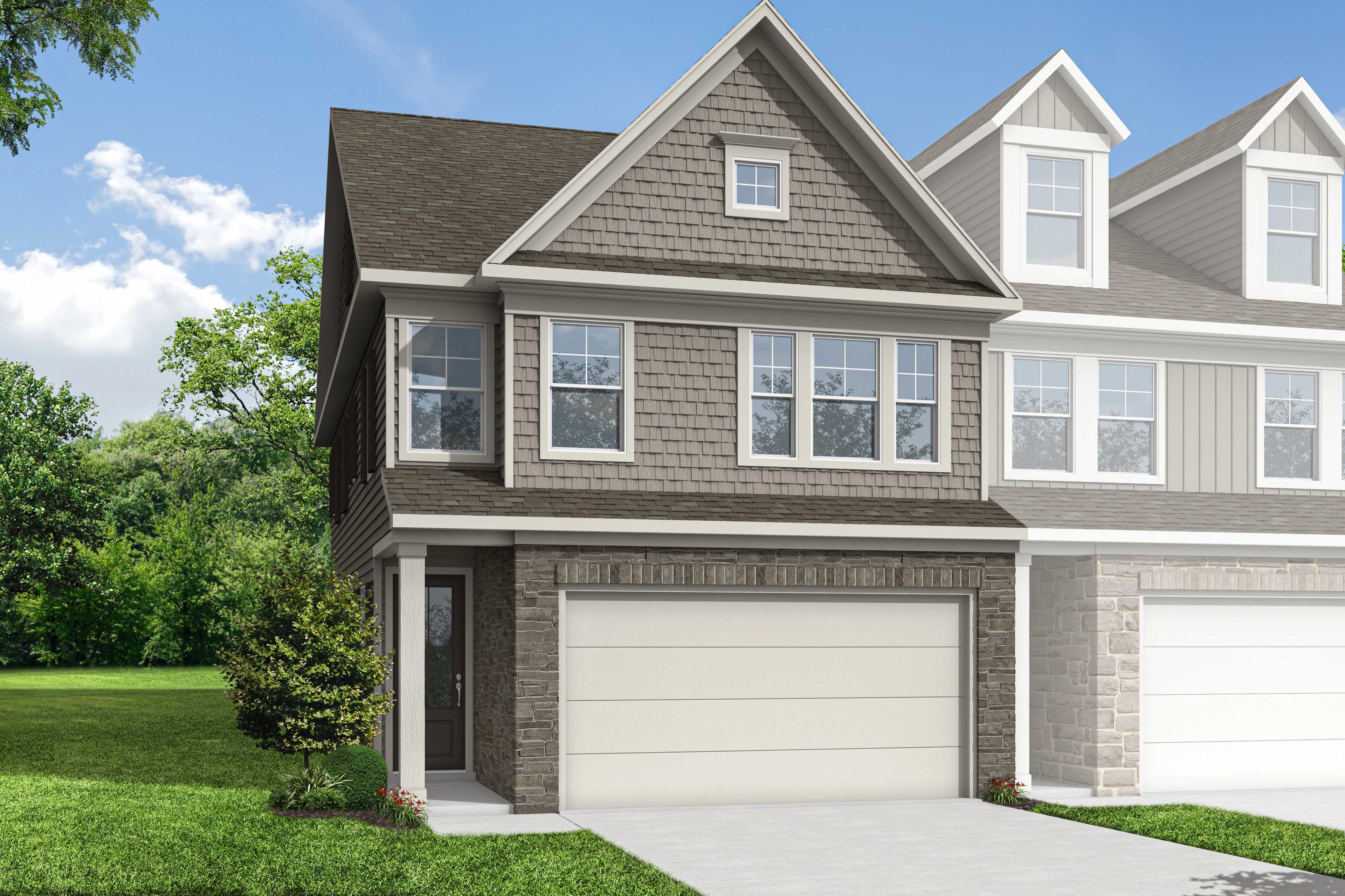 2-story multi-family home elevation of The Wake by Davidson Homes, showcasing gray siding, stone accents, dual 2-car garages, and lush landscaping