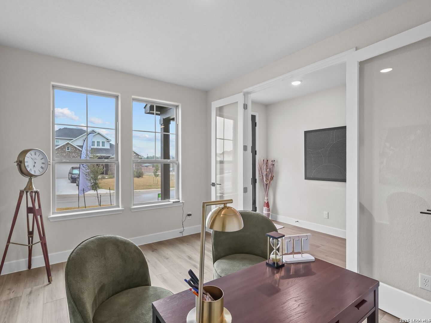 Bright home office with French doors in 5-bedroom Davidson Homes Belmont floor plan, Potranco Oaks, Castroville, Texas.