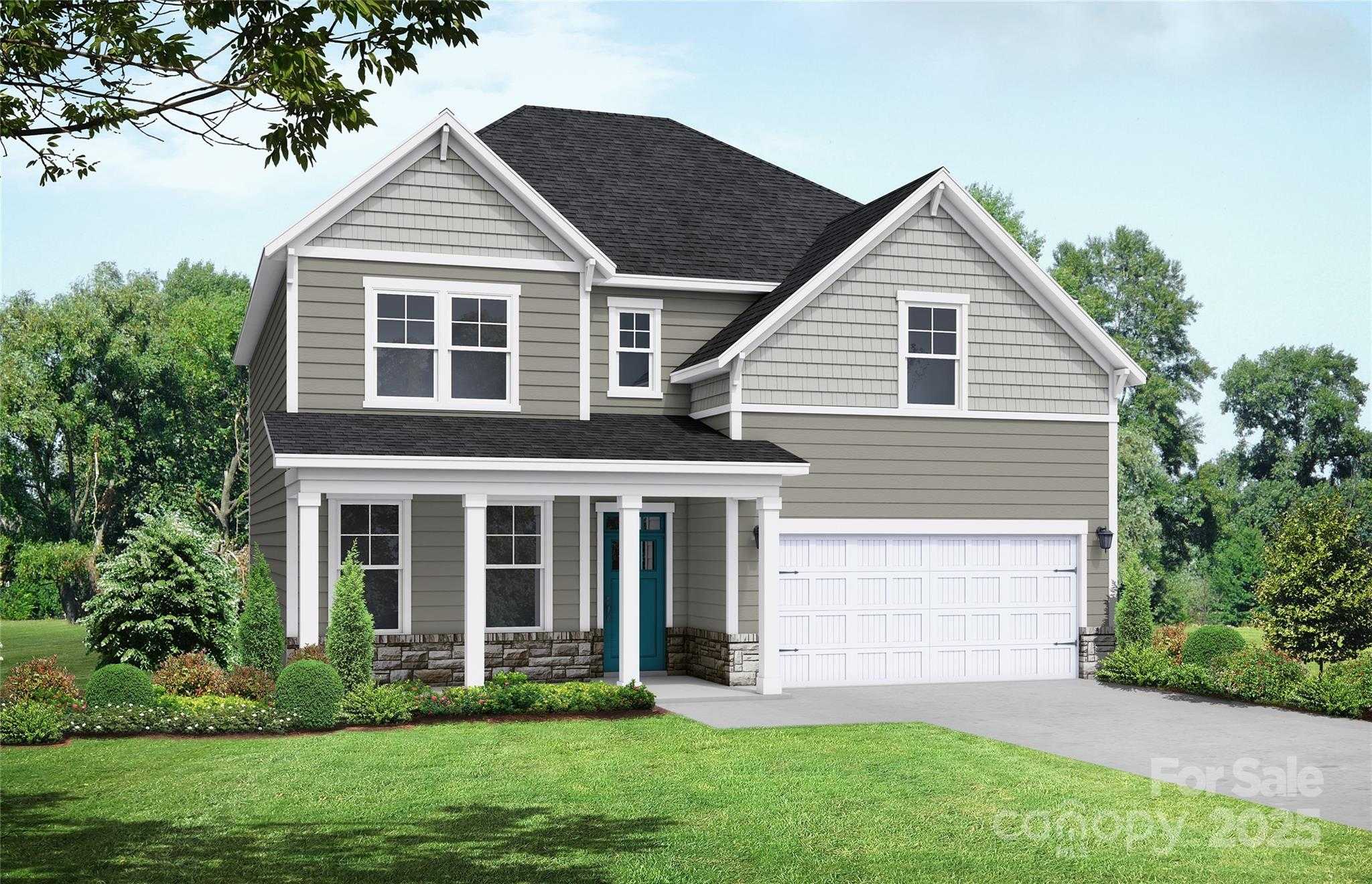 Two-story gray home with front porch, two-car garage, and lush landscaping in Enclave at Belmont, Davidson Homes Hemlock A