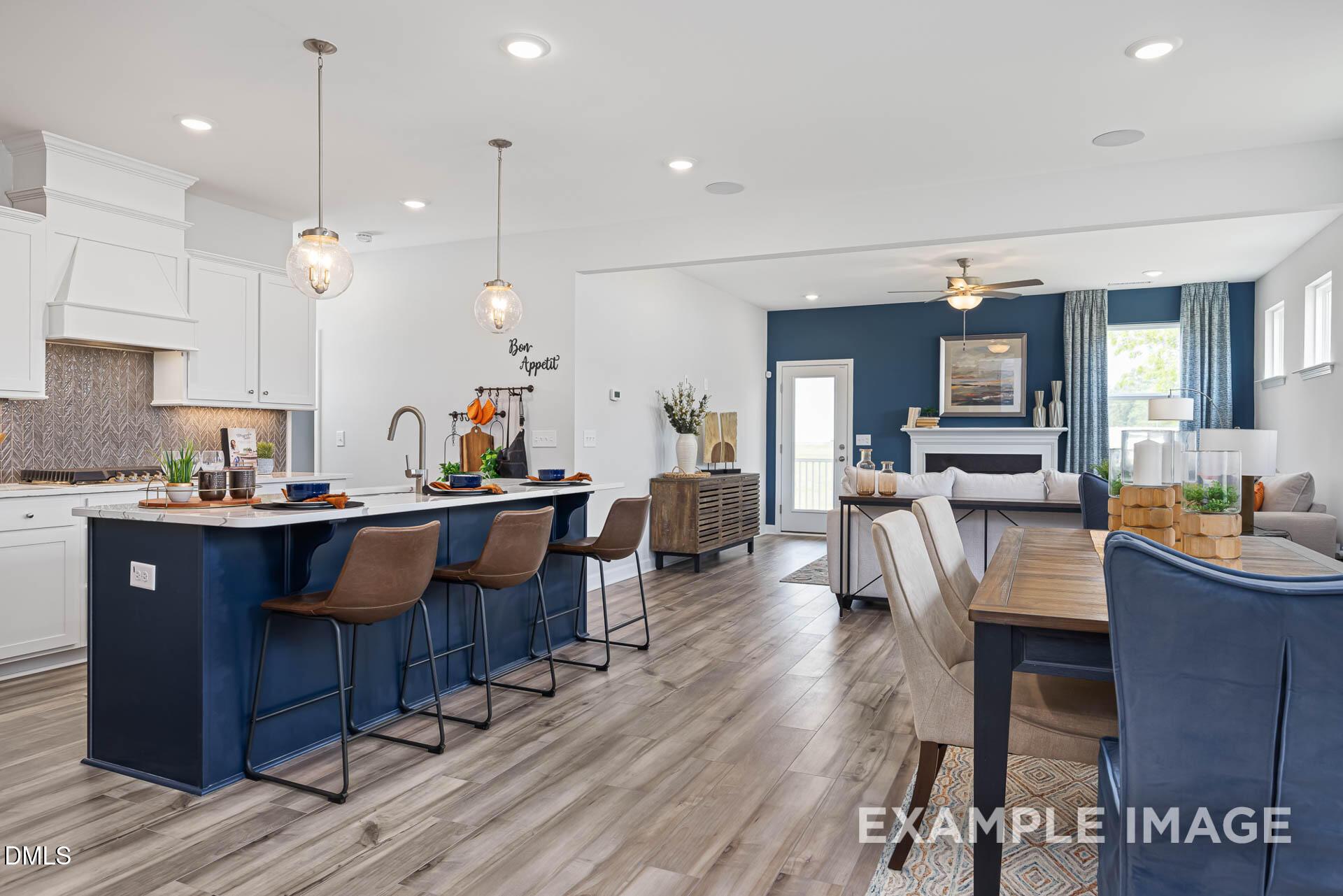 Open-concept kitchen and living area in The Adalynn A floor plan at Woodland Crossing, Zebulon, North Carolina.