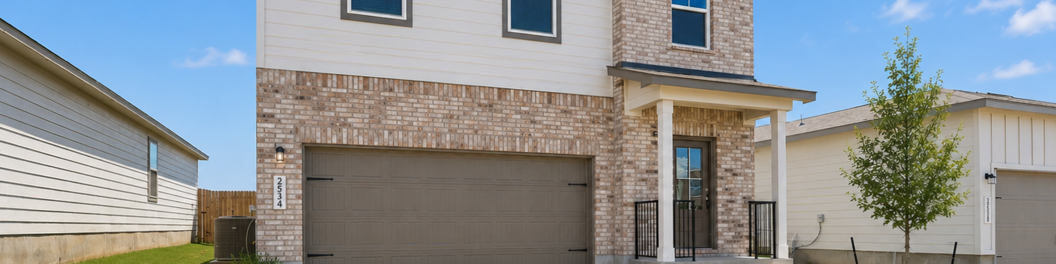 Two-story brick and siding home exterior at Fairway Crossing in Converse, Texas, built by Davidson Homes.