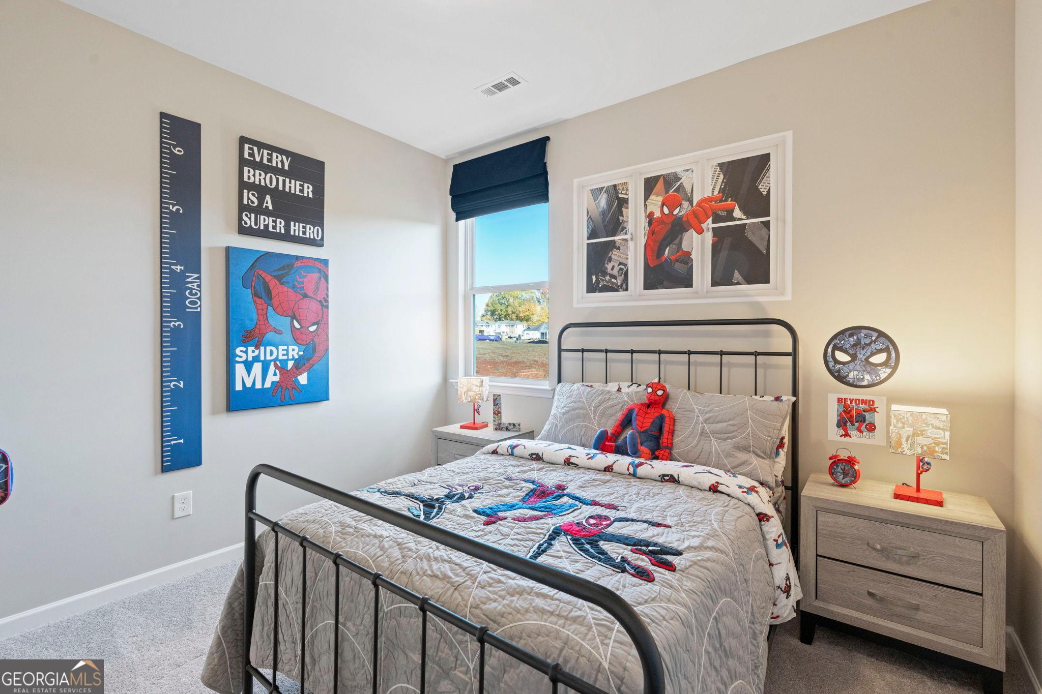 Spiderman-themed bedroom in The Phoenix floor plan at Ivy Glen, Perry, Georgia.