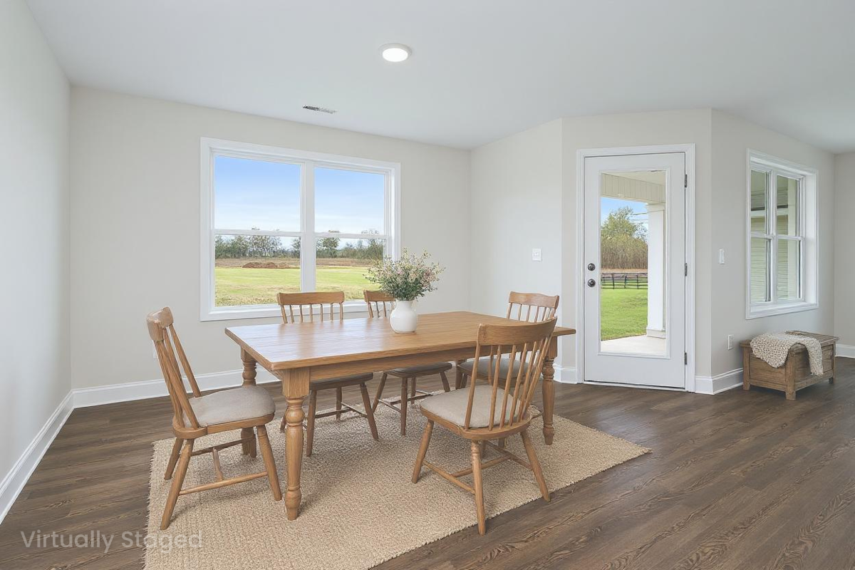 Spacious dining room in Chapel Hill Athens Alabama with wooden table chairs large windows and green lawn view