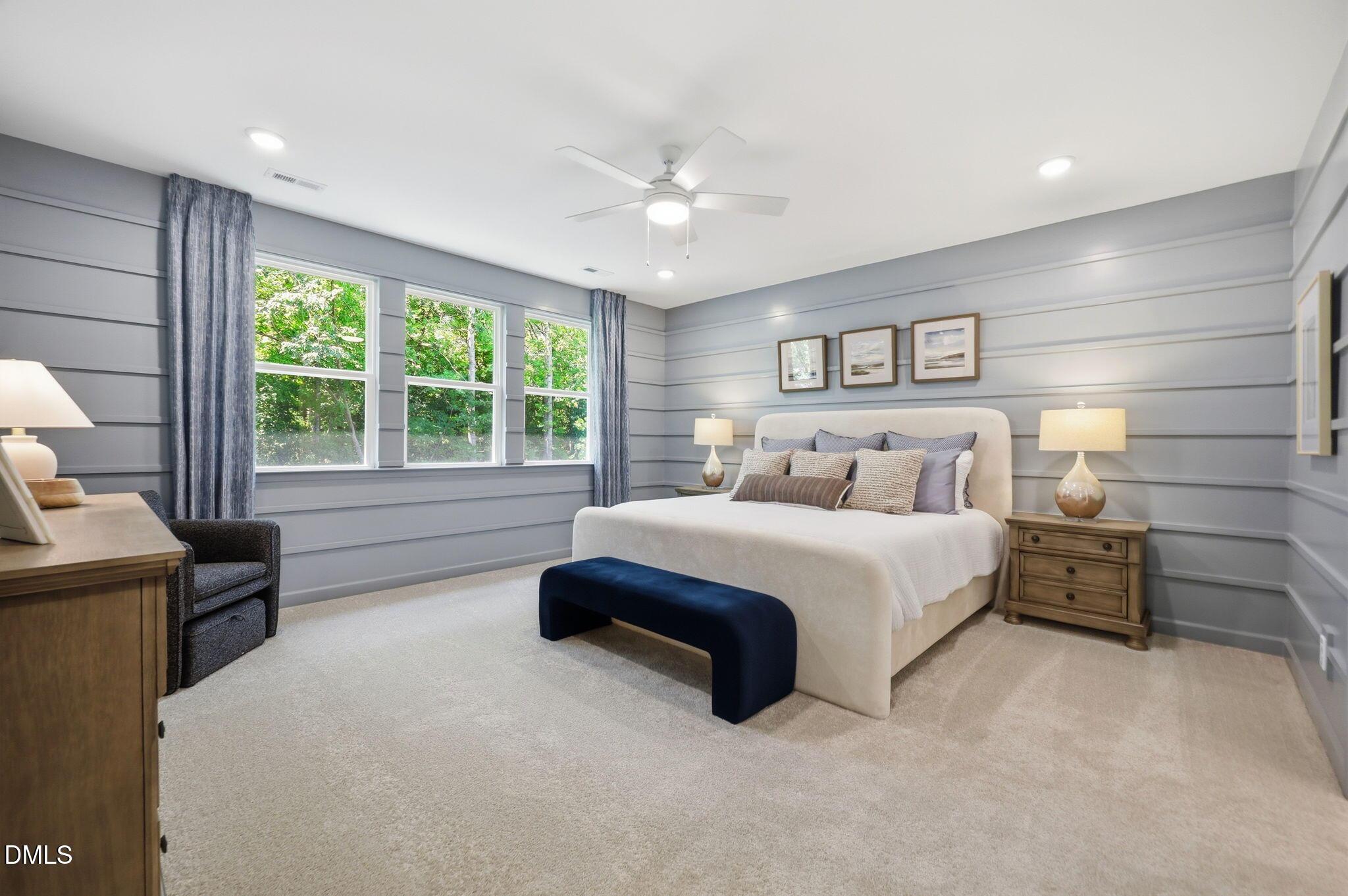 Spacious primary bedroom with shiplap walls and plush carpet in The Aspen B floor plan at Wendell Ridge, North Carolina.