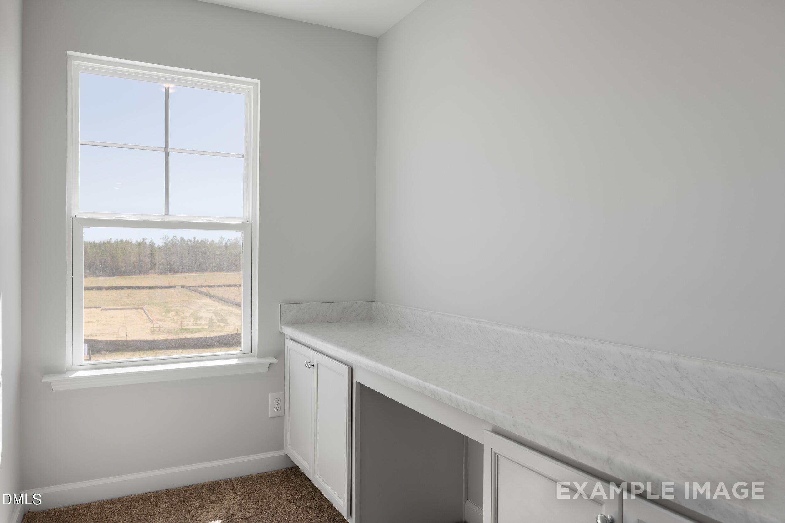 Built-in desk with marble-style countertop in Gavin A floor plan home at Gregory Village, Lillington, North Carolina.