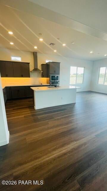 Modern open-concept kitchen with large island and dark cabinetry in The Aurea C floor plan, Hidden Hills, Prescott, AZ.