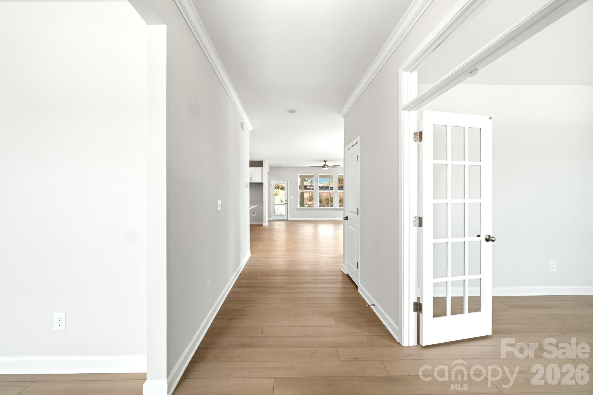Bright entryway with French doors and hardwood floors in The Magnolia B floor plan, Windgate, Mooresville, NC.