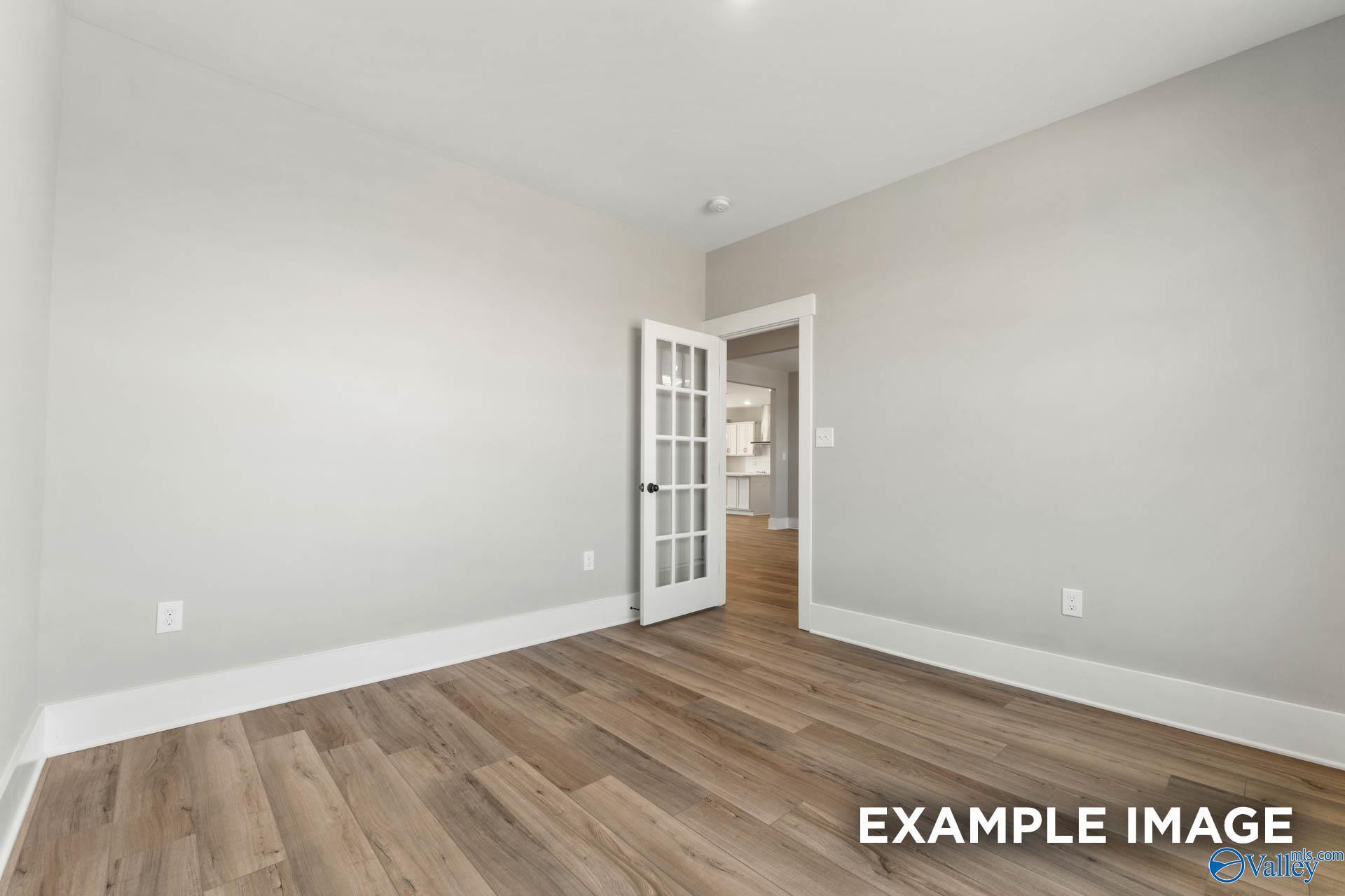 Bright home office or flex room with French doors in The Finleigh floor plan by Davidson Homes, Meridianville, Alabama.