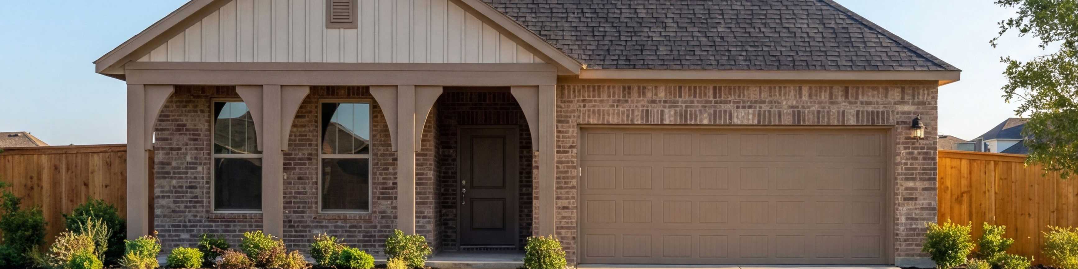 Modern brick and stone farmhouse exterior by Davidson Homes at Meadow Ridge Estates in Josephine, Texas