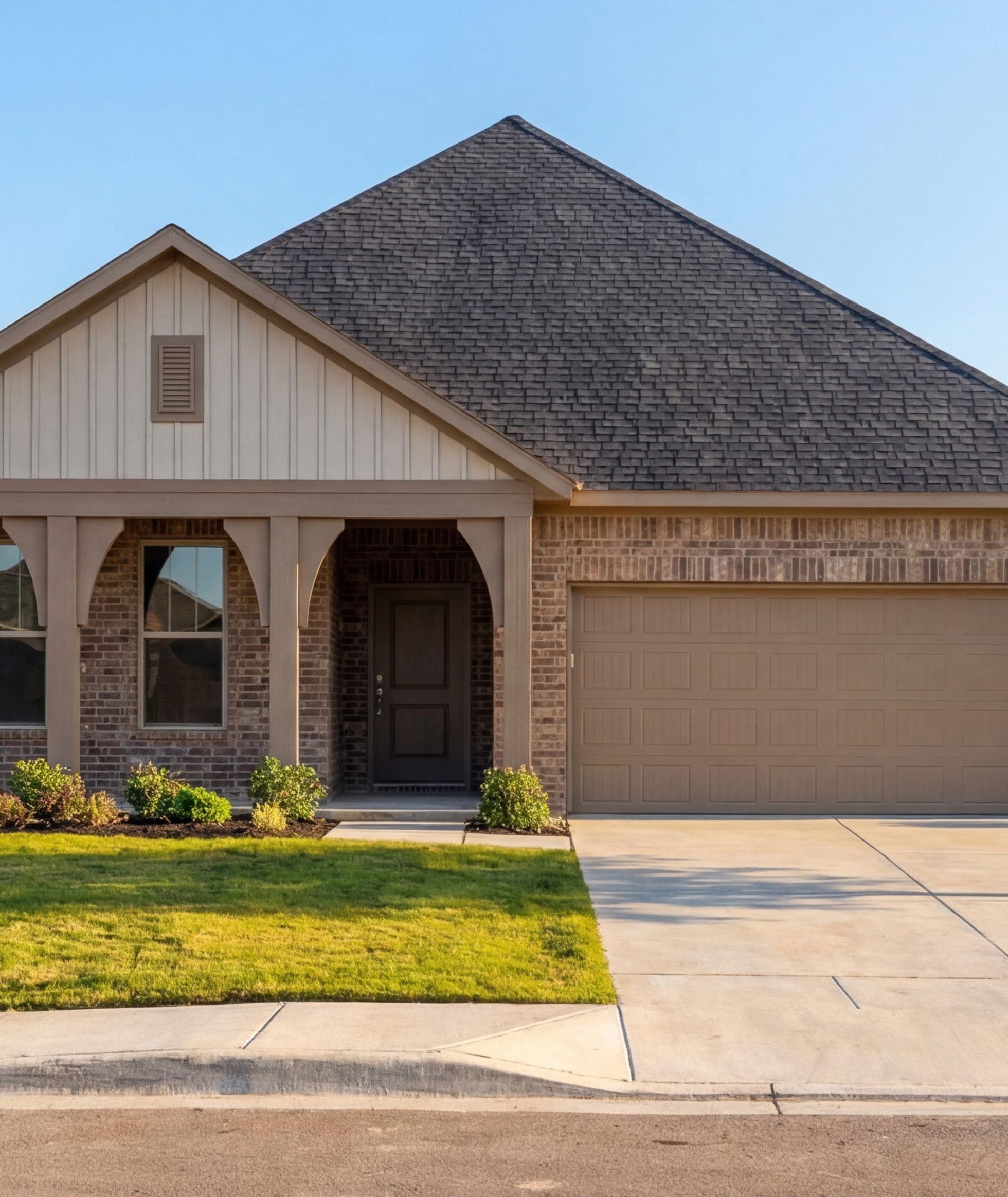 Modern brick and stone farmhouse exterior by Davidson Homes at Meadow Ridge Estates in Josephine, Texas