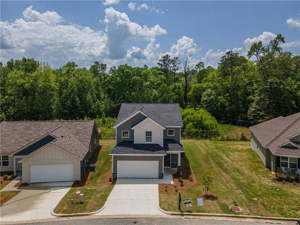 Two-story gray home with 2-car garage and driveway in wooded Summer Vineyard neighborhood, Phenix City, Alabama - Davidson Homes Bartlett