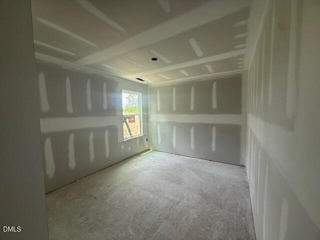 Unfinished bedroom with drywall and tray ceiling in The Birch II A floor plan at Montrose in Aberdeen, North Carolina.