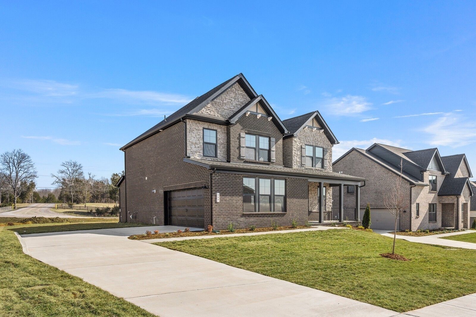 Two-story Willow D floor plan by Davidson Homes with brick exterior, 2-car garage, in Benders Cove, Mt. Juliet, Tennessee.