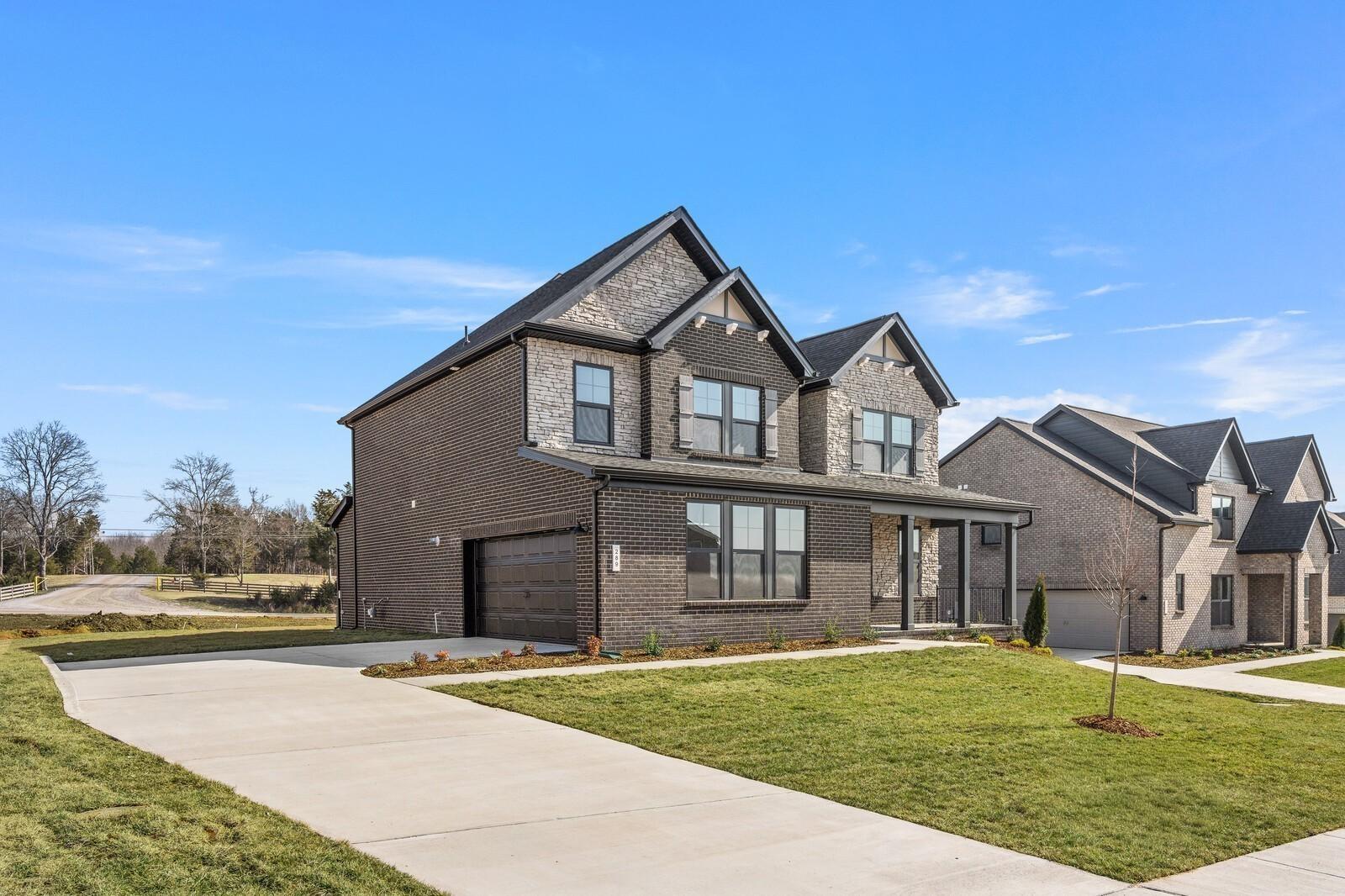 Two-story Willow D floor plan by Davidson Homes with brick exterior, 2-car garage, in Benders Cove, Mt. Juliet, Tennessee.