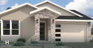 Modern single-story home with beige siding, brick entry, large windows, and 2-car garage in Prescott, Arizona - Davidson Homes The Boulder II H