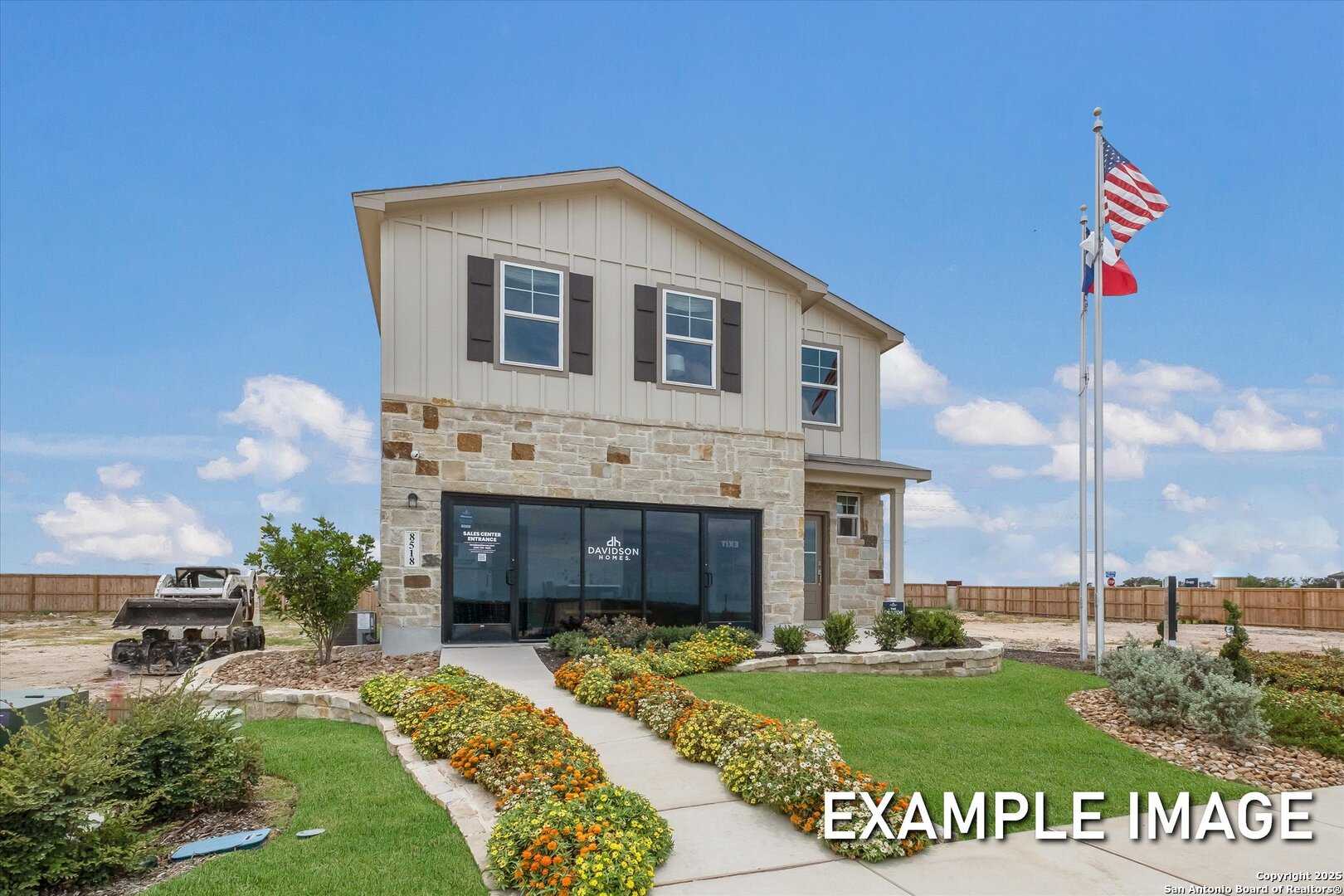 Two-story beige home with stone accents, shutters, American and Texas flags, landscaped front yard in Agave, San Antonio, Texas