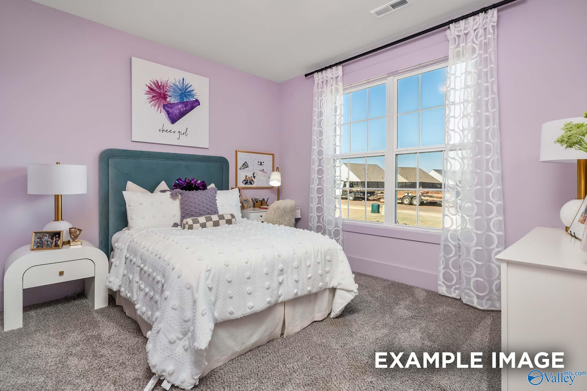 Vibrant pink girl's bedroom with tufted white bed, boss girl headboard, and neighborhood window view in Davidson Homes The Rockford B, Madison, Alabama