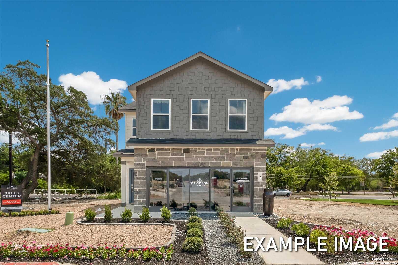 Modern two-story 4-bedroom Davidson Homes exterior with stone facade, large windows, and landscaped entry in Meadows at Oak Creek, San Antonio, Texas