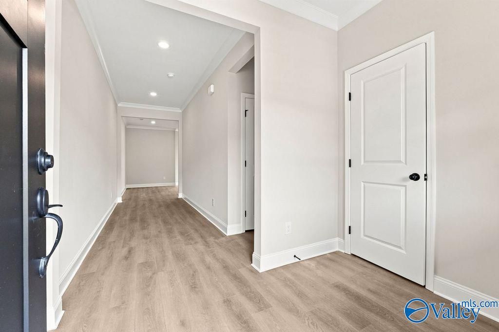 Bright entryway with light wood-style flooring in The Camilla B floor plan at The Retreat at Cain Park in Hartselle, AL.
