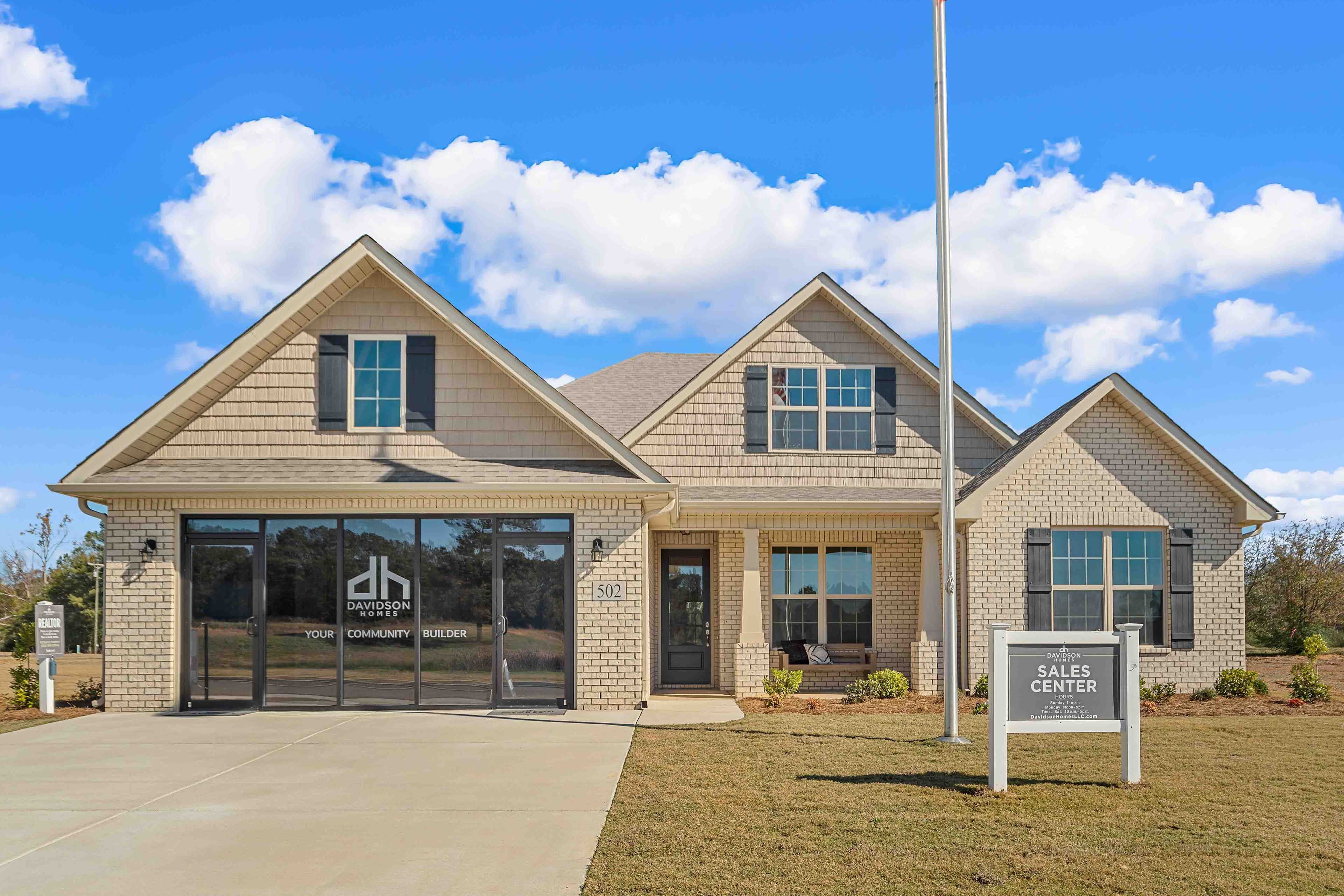 Modern Craftsman home exterior at Cain Park in Hartselle, Alabama with two-car garage and gabled roof