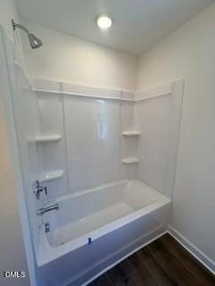 Modern white shower and bathtub combo in a Davidson Homes Willow B floor plan in Woodland Crossing, Zebulon, North Carolina.