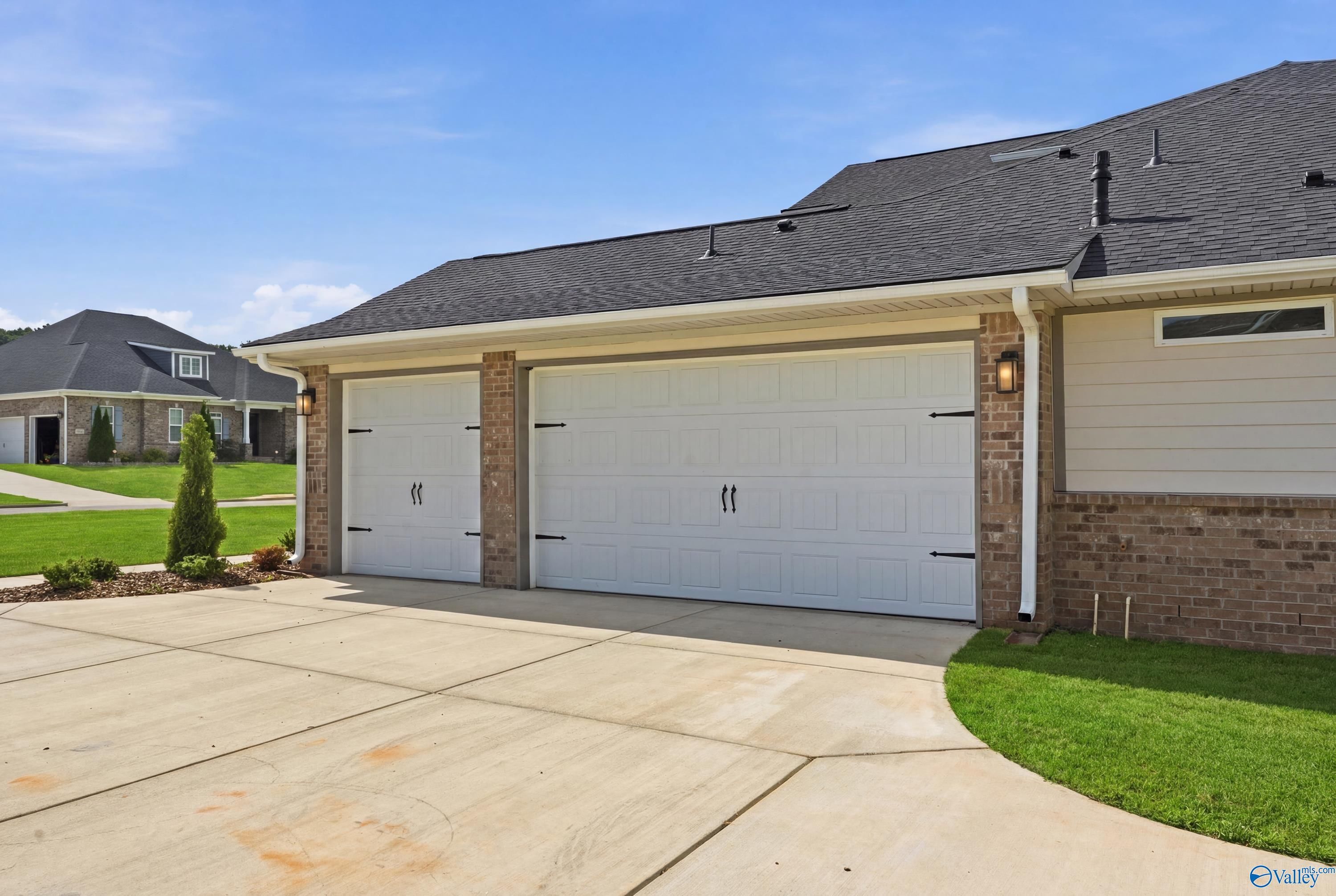 Attached 3-car garage on The Dorado floor plan by Davidson Homes in Riverton Preserve, Huntsville, Alabama.