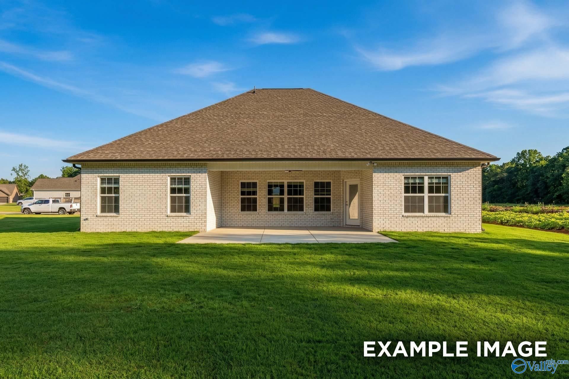 Back exterior view of The Rockford floor plan by Davidson Homes featuring a covered patio in Briercreek, Meridianville.