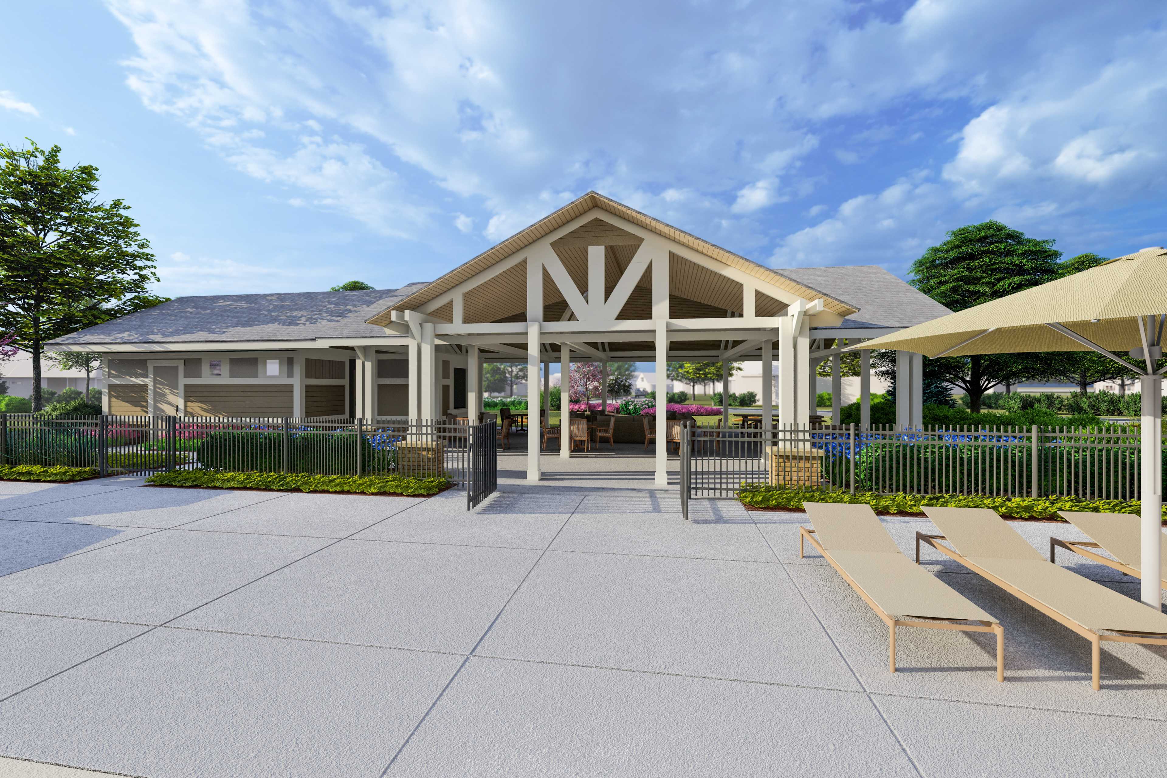 Covered pavilion with wooden beams, lounge seating, umbrellas, and landscaping at Creekside in Harvest, Alabama