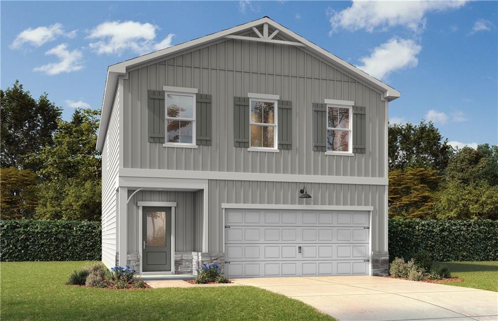 The Burton B craftsman 2-story home by Davidson Homes with 2-car garage at The Bluffs in Canton, Georgia.