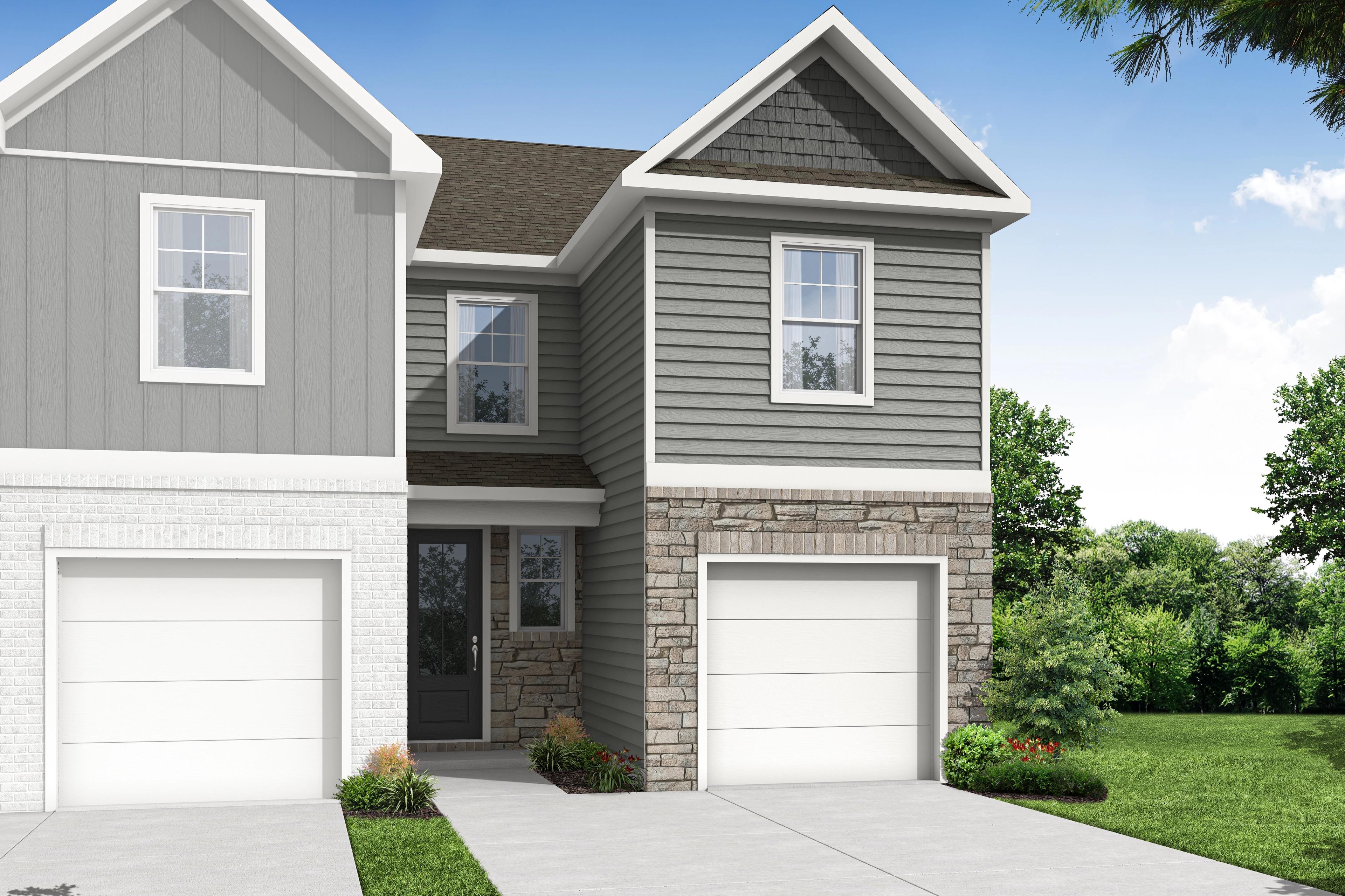 Wilmington B two-story multi-family duplex with gray siding, stone accents, one-car garages, and landscaped front yard
