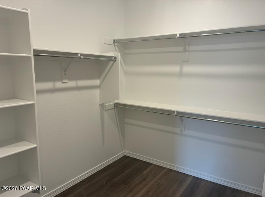 Walk-in closet with white shelving and storage in The Malibu B floor plan at South Ranch, Prescott, Arizona.