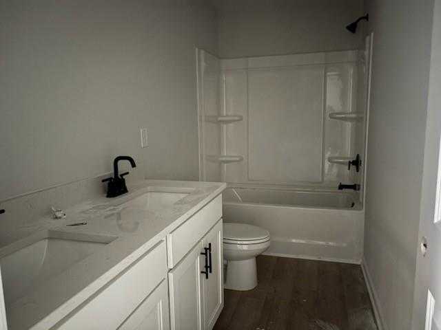 Modern secondary bathroom with white vanity, black faucet, tub-shower combo in Davidson Homes The Rabun C, Winder, Georgia