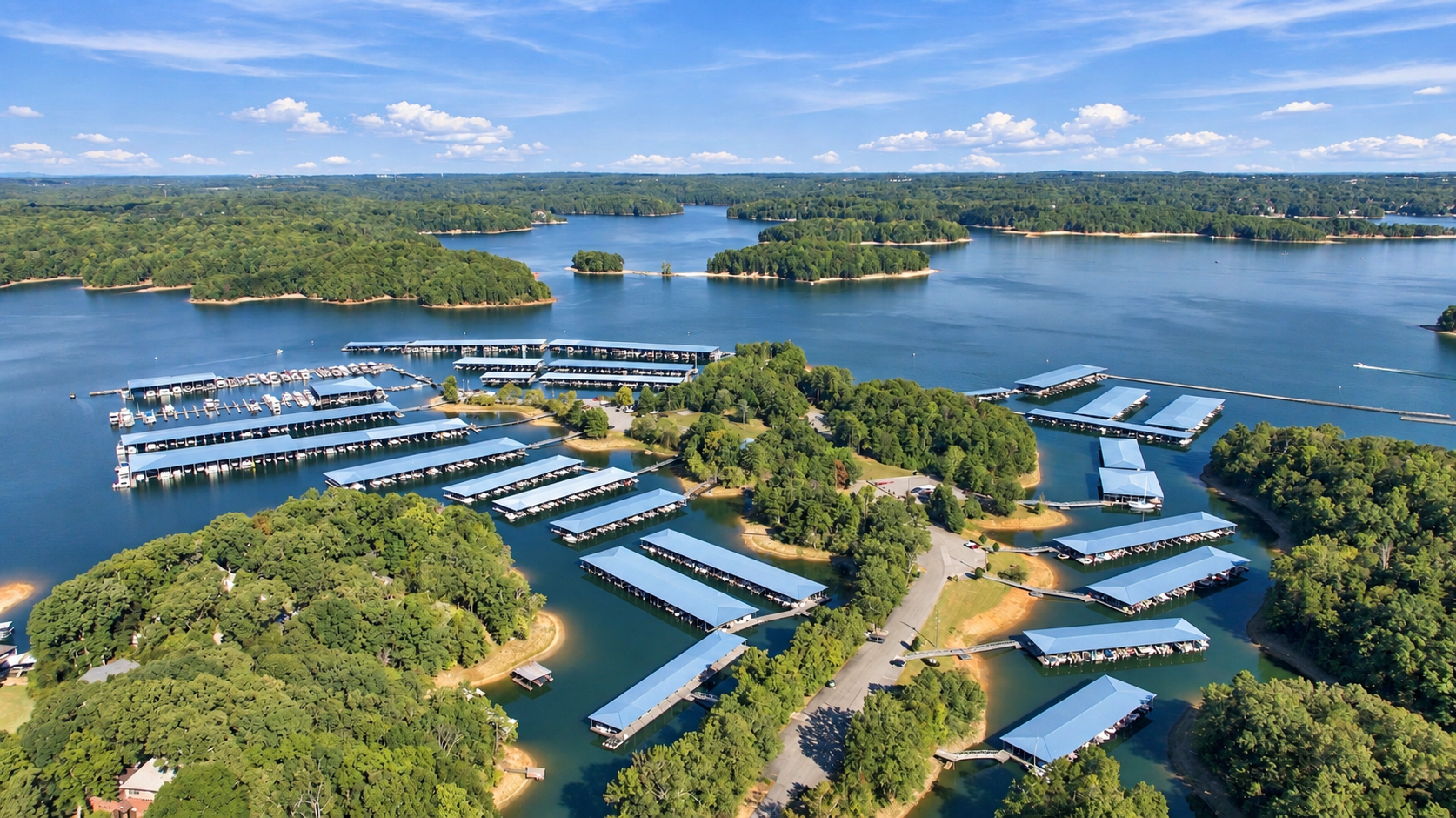 Aerial view of Lake Lanier marina with covered boat docks near Lake Hollow community in Gainesville, Georgia