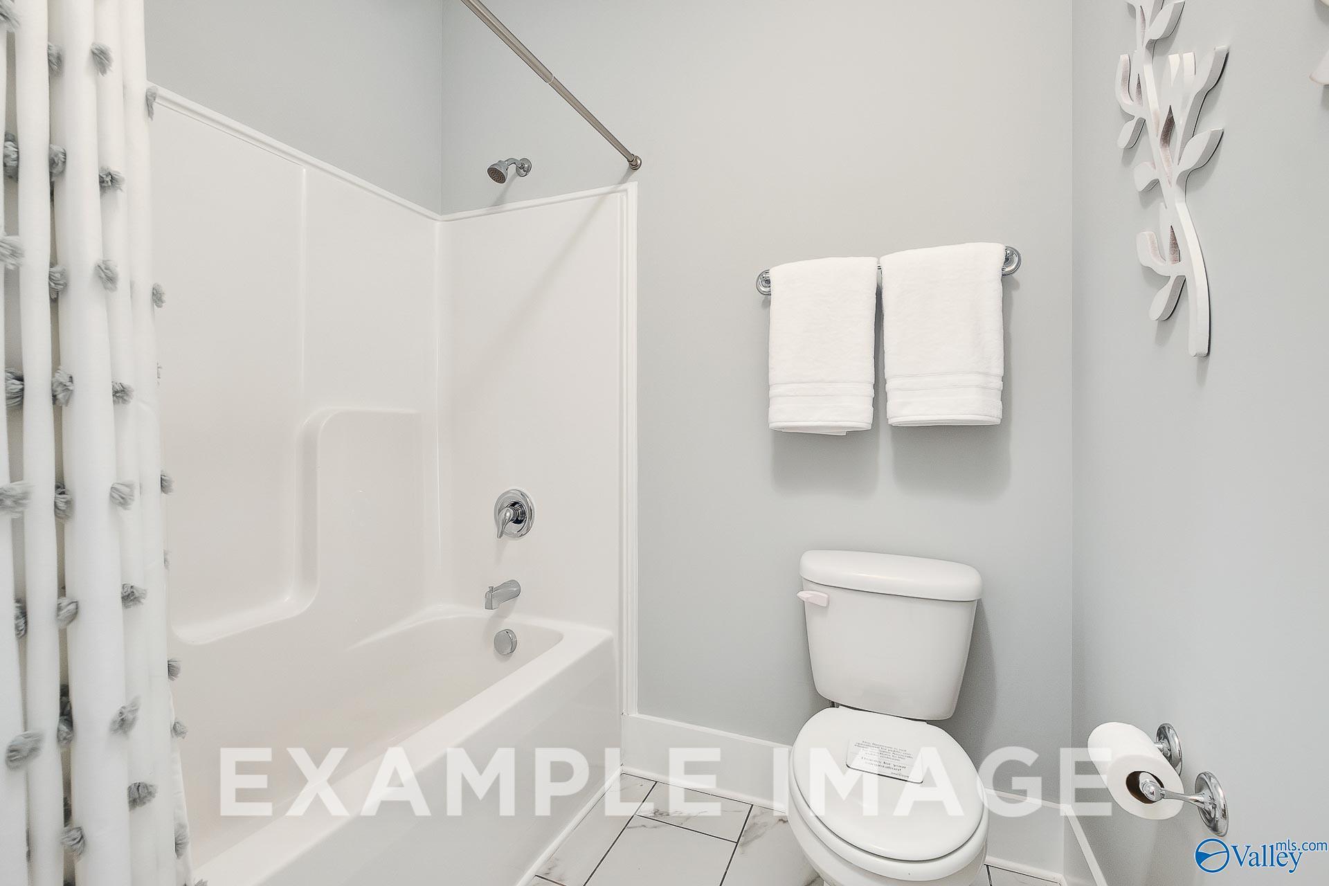 Full bathroom with tub-shower combo in The Everett B floor plan at The Meadows in Athens, Alabama.