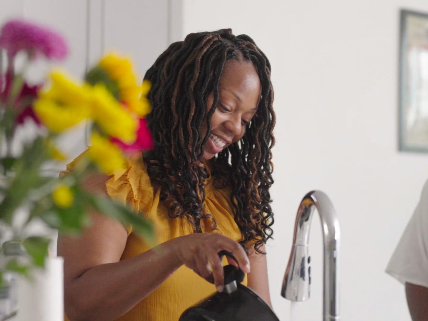 Homeowner Tiffany E. smiling in her kitchen