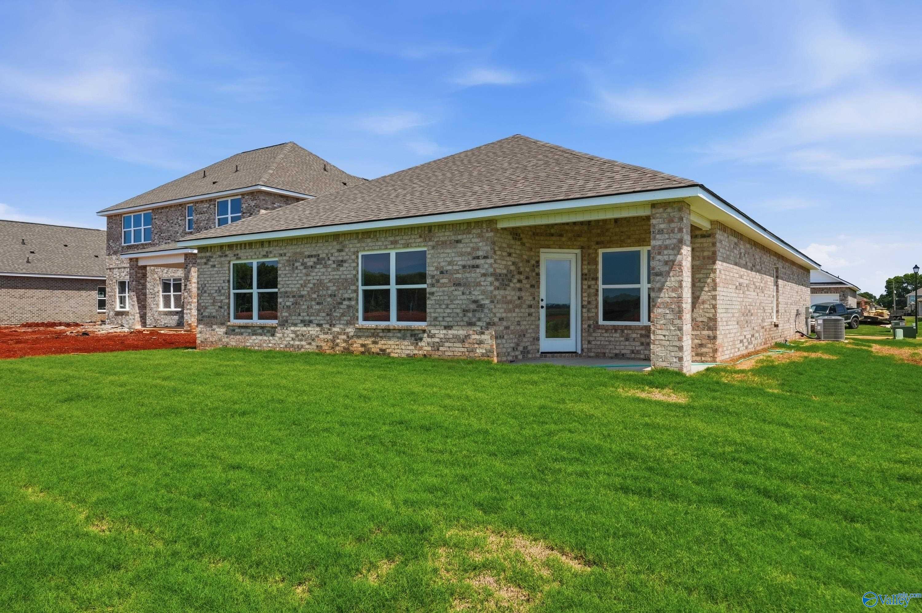 Rear exterior view of The Daphne floor plan by Davidson Homes in Clearview, Hazel Green, Alabama with a private backyard.