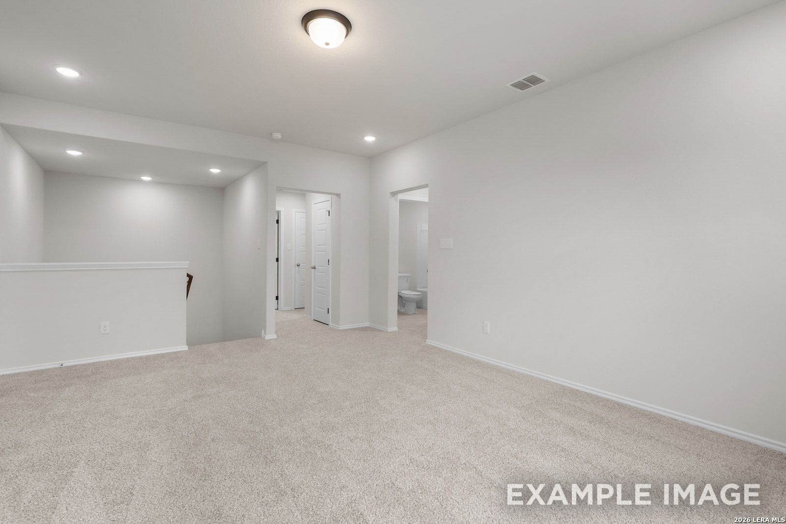 Spacious carpeted upstairs loft in The Sequoia C floor plan by Davidson Homes in Royal Crest, San Antonio, Texas.