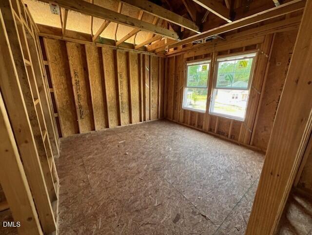 Unfinished bedroom framing with windows in The Willow D floor plan at Wellers Knoll in Lillington, North Carolina.