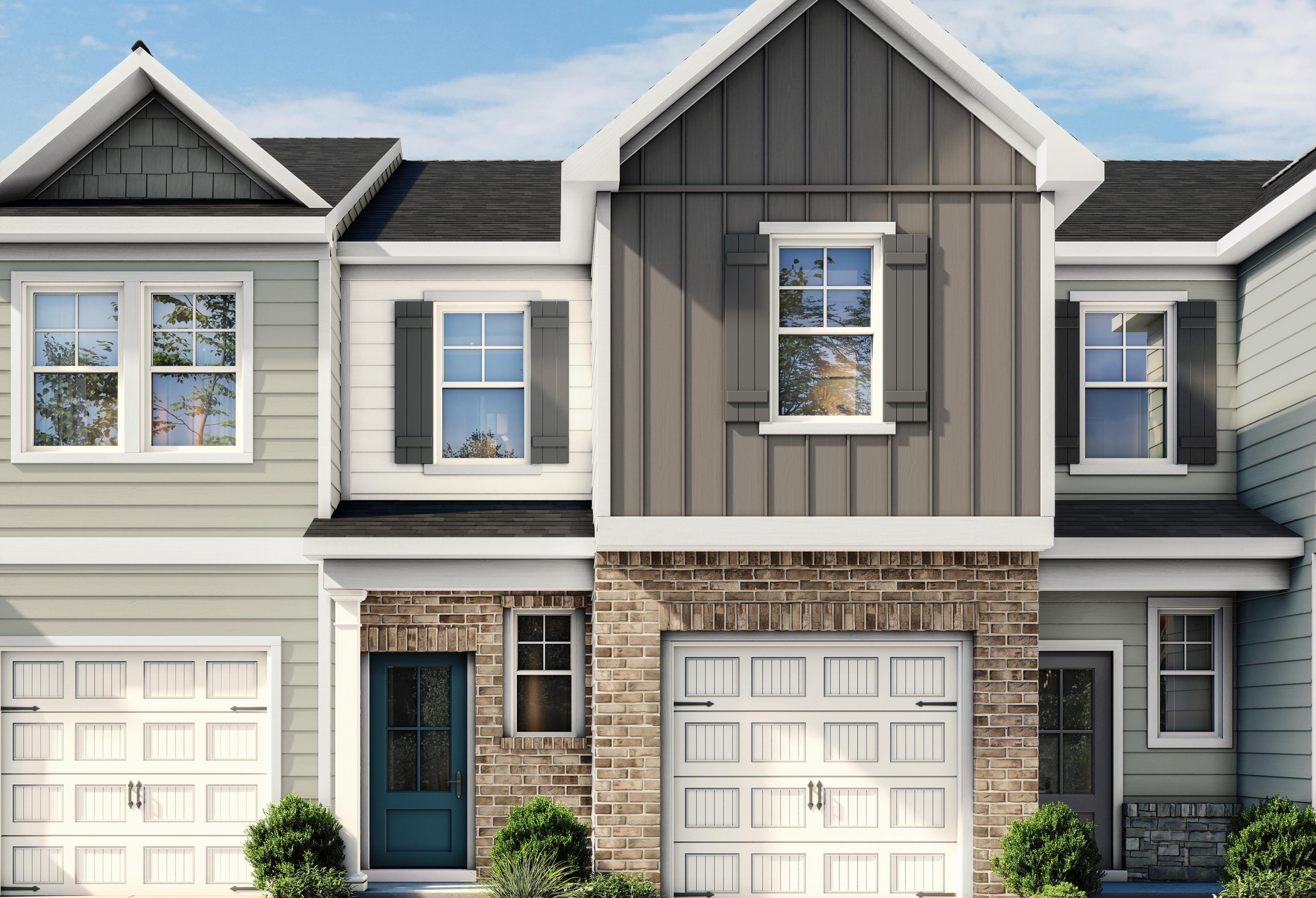 Modern exterior of The Wilmington II multi-family home featuring brick, siding, and a one-car garage in Lillington, NC.