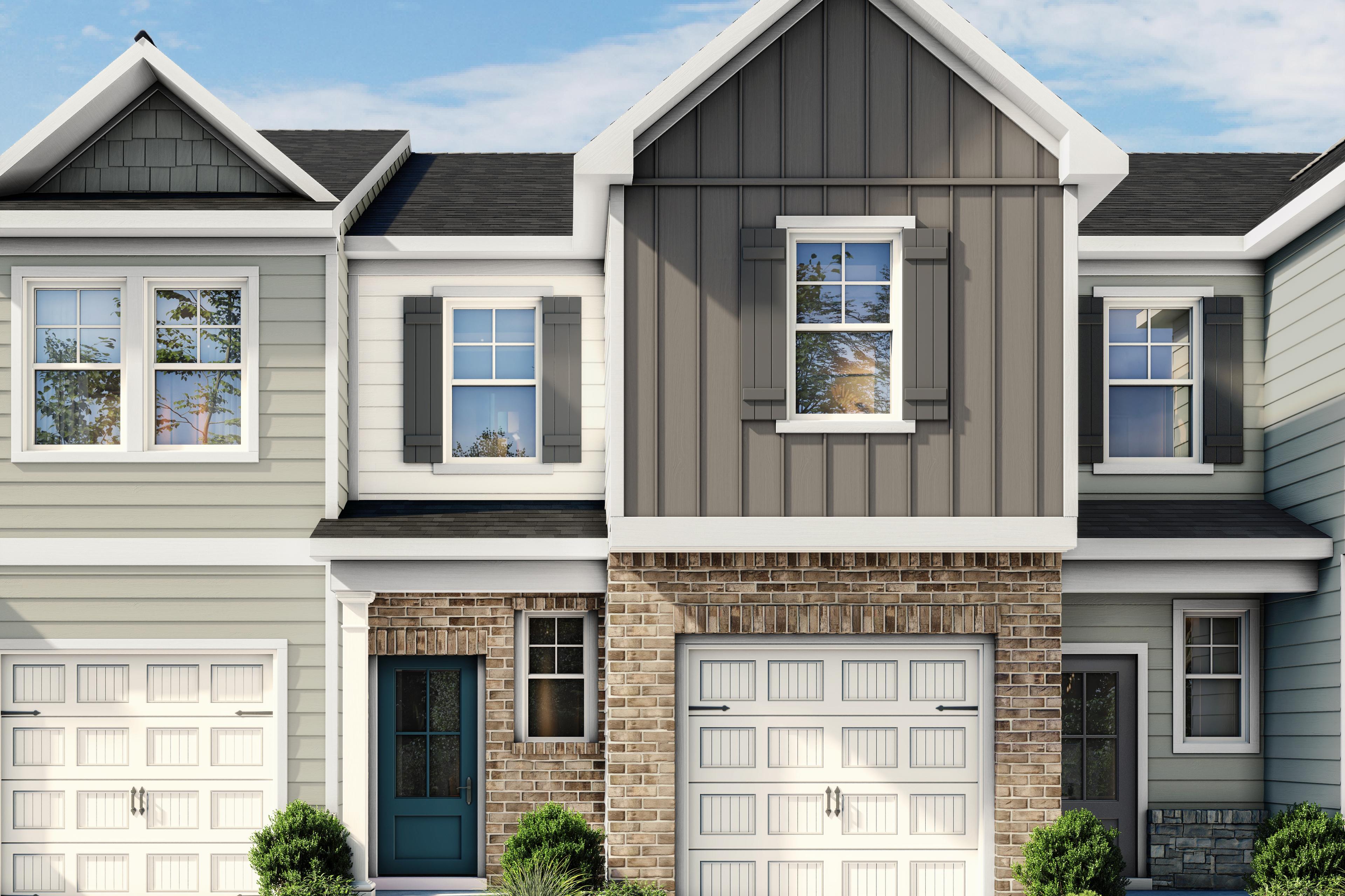 Modern exterior of The Wilmington II multi-family home featuring brick, siding, and a one-car garage in Lillington, NC.