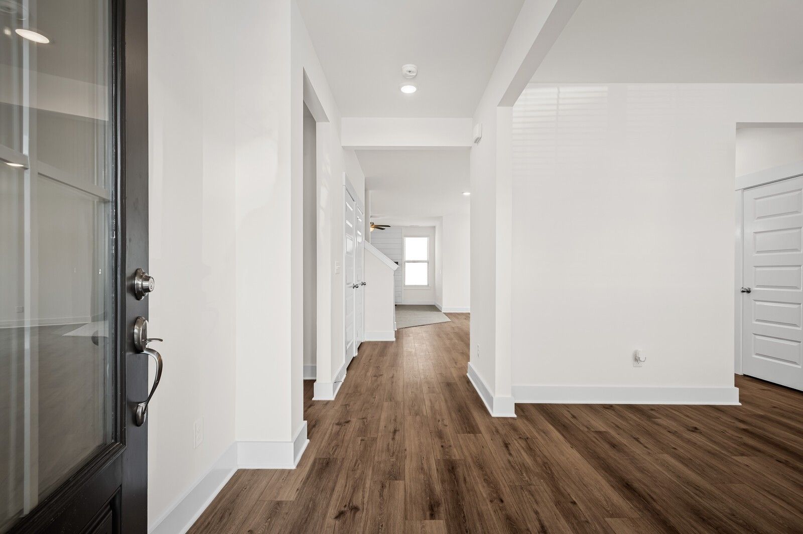 Bright, open foyer with hardwood-style flooring in The Ash A floor plan at Woods Crossing, Gallatin, Tennessee.