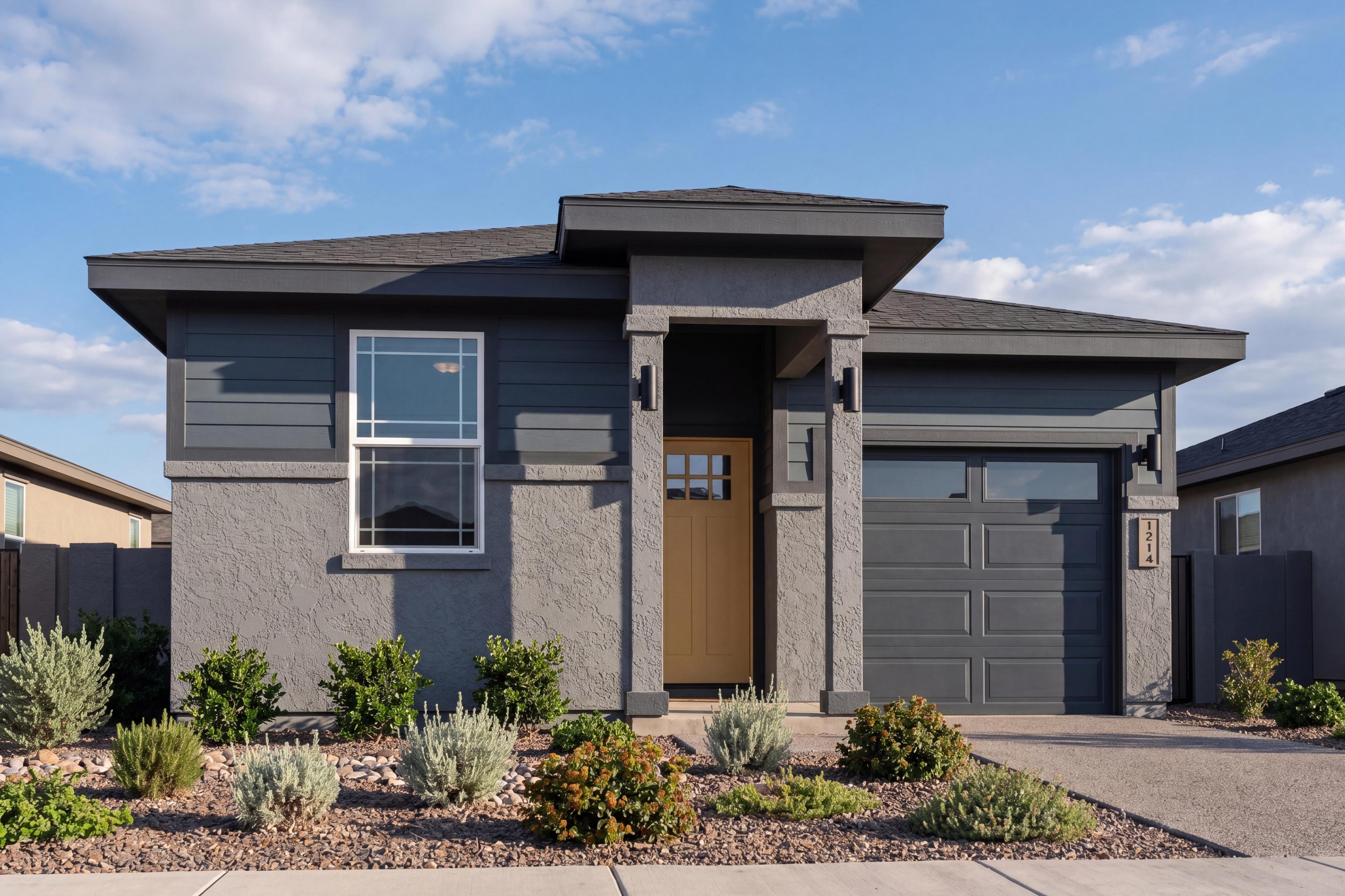 Modern exterior of The Savannah by Davidson Homes in Prescott, featuring a 1-story design with gray siding and garage.