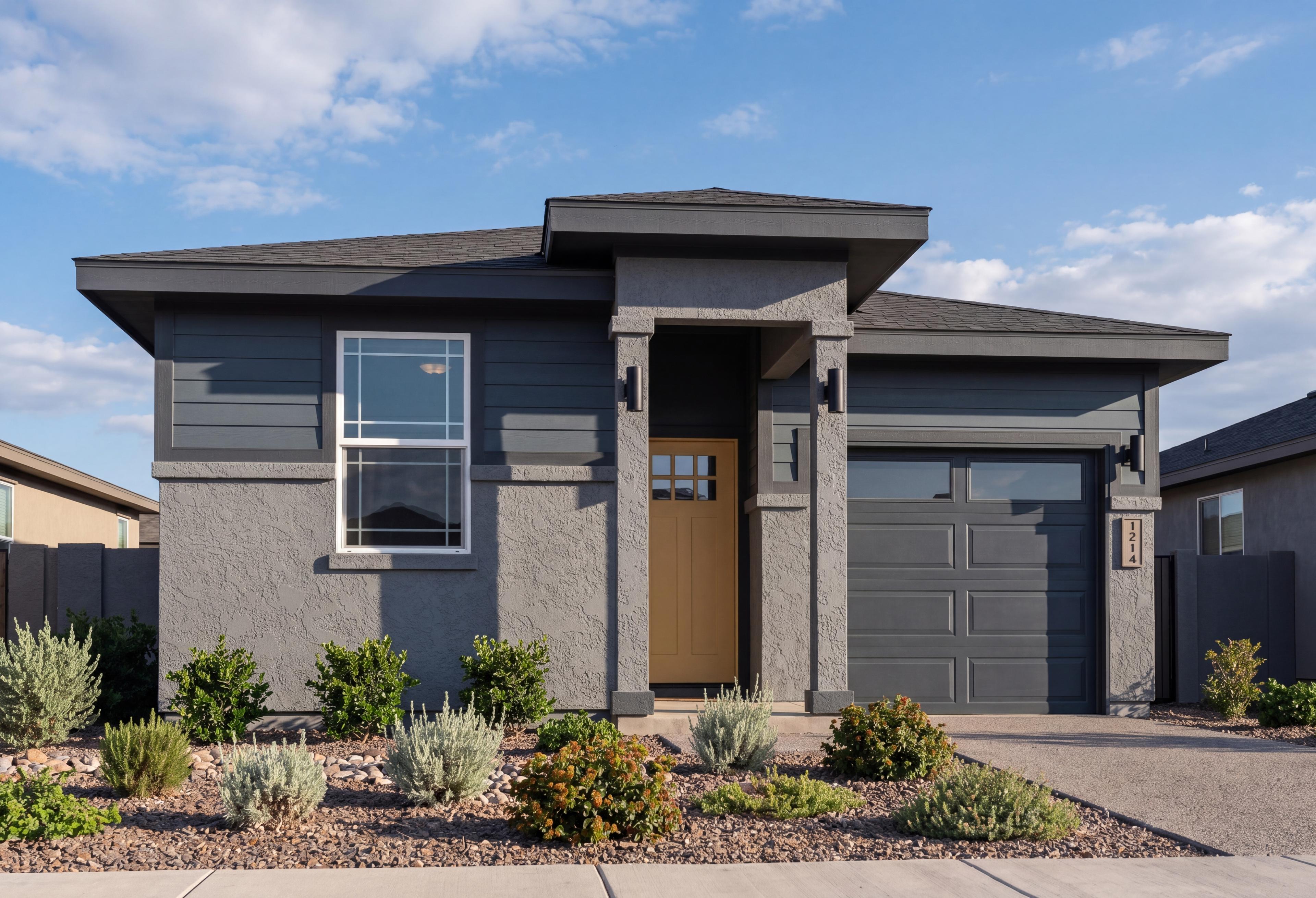 Modern exterior of The Savannah by Davidson Homes in Prescott, featuring a 1-story design with gray siding and garage.