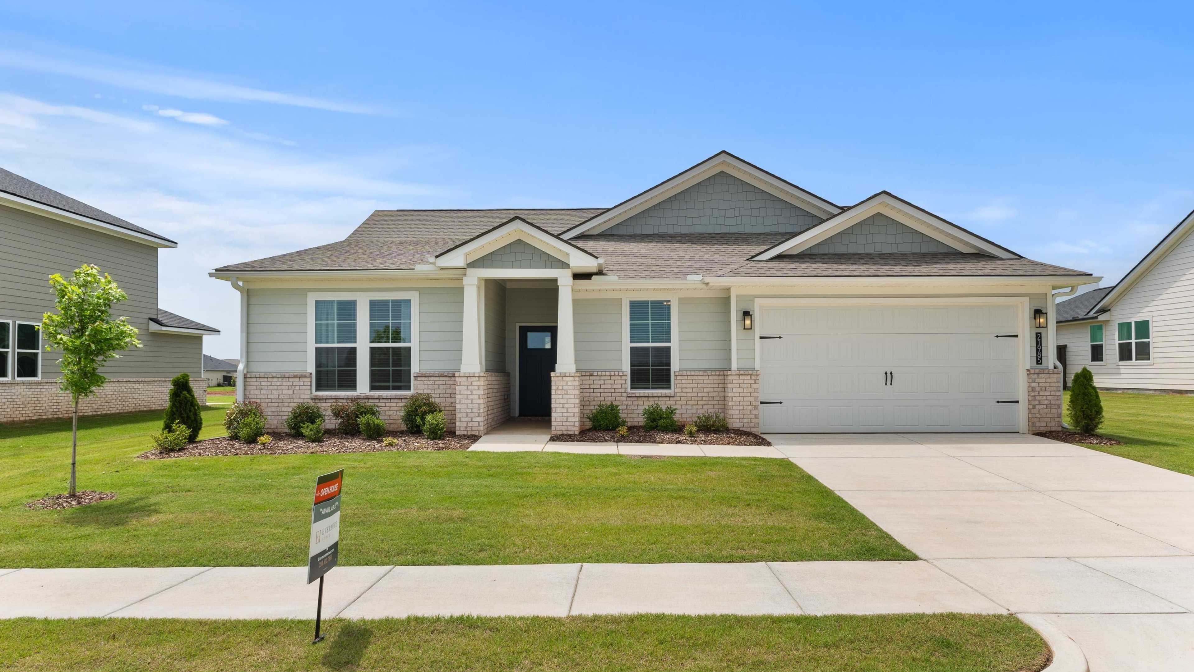 Open house at 21985 Huntington Pike: Modern beige Davidson Homes with brick accents, garage, landscaped yard, for sale sign