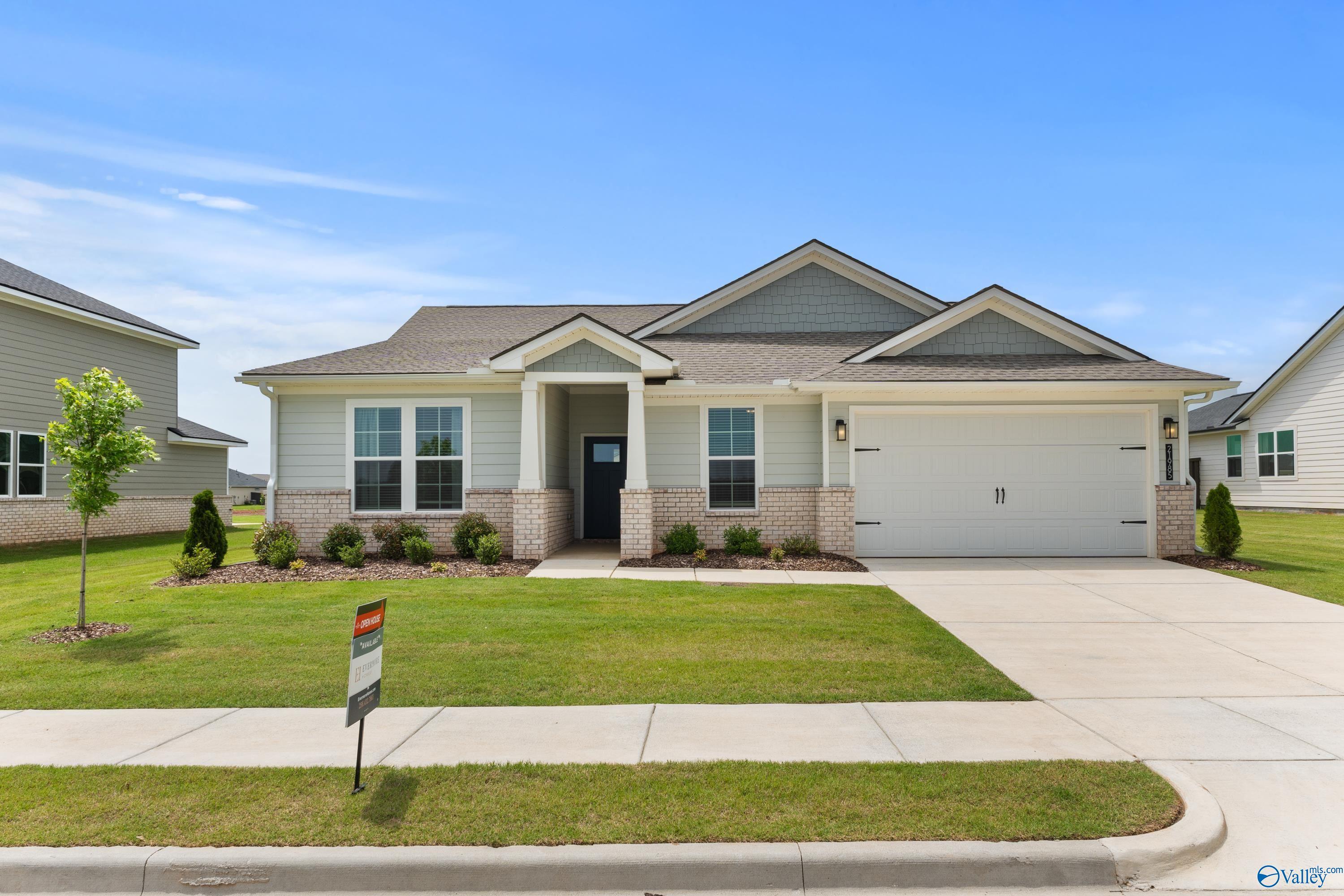 Modern single-story 4-bedroom home with 3-car garage, brick accents, and landscaped yard in Anderson Farm, Athens, Alabama by Davidson Homes