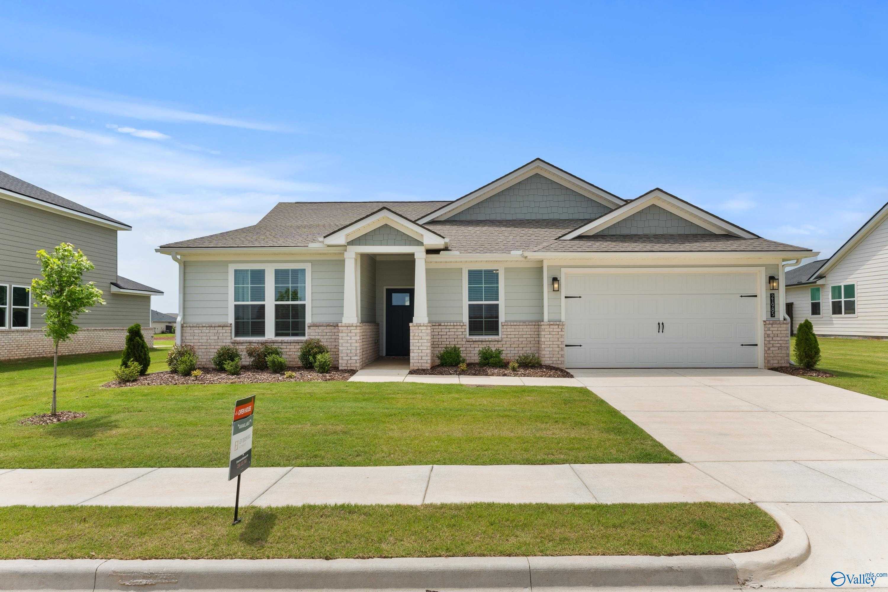 Modern single-story 4-bedroom home with 3-car garage, brick accents, and landscaped yard in Anderson Farm, Athens, Alabama by Davidson Homes